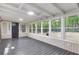 Sunroom with recessed lighting, wood paneled walls and multiple windows providing natural light at 4212 Bryan Se Dr, Acworth, GA 30102