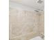 Close up on the shower in the primary bathroom featuring an elegant design and tiled walls at 6429 Woodstone Way, Morrow, GA 30260