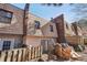 View of back of house with fenced yard and brick detailing at 6429 Woodstone Way, Morrow, GA 30260