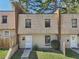Charming townhome exterior with well-maintained lawn and sidewalk at 6429 Woodstone Way, Morrow, GA 30260