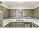 Kitchen area with stainless steel appliances and decorative backsplash at 6429 Woodstone Way, Morrow, GA 30260