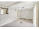 Open living room adjacent to kitchen featuring modern ceiling fan at 6429 Woodstone Way, Morrow, GA 30260