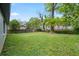 The backyard is spacious and green with a wood fence for privacy at 664 Florence Nw Pl, Atlanta, GA 30318