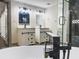 A bathroom with a modern soaking tub, dual sinks, vanity, and an elegant black marble faucet at 664 Florence Nw Pl, Atlanta, GA 30318