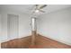 A bright bedroom has hardwood floors, neutral walls, and a ceiling fan providing comfort and style at 664 Florence Nw Pl, Atlanta, GA 30318