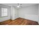 This bedroom offers hardwood floors, natural light, and a ceiling fan at 664 Florence Nw Pl, Atlanta, GA 30318