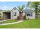 Charming bungalow-style home featuring a cozy front yard and a convenient carport at 664 Florence Nw Pl, Atlanta, GA 30318