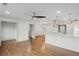 Renovated open-concept living space featuring hardwood floors, granite countertops, and modern lighting at 664 Florence Nw Pl, Atlanta, GA 30318