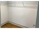 Walk-in closet featuring a wire shelving system and hardwood flooring, for optimal storage at 664 Florence Nw Pl, Atlanta, GA 30318