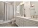 Bright bathroom with dual sink vanity, white countertops, and a shower with decorative curtain at 1003 North Ne Ave, Atlanta, GA 30306