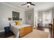 Comfortable bedroom boasts dark wood floors, light grey walls, and unique decor at 1003 North Ne Ave, Atlanta, GA 30306