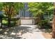 Exterior of house with garage, parking space, lush landscaping, and partial view of a deck at 1003 North Ne Ave, Atlanta, GA 30306