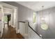 Bright hallway features hardwood floors, transom window, and access to bedrooms at 1003 North Ne Ave, Atlanta, GA 30306