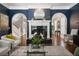Elegant living room showcasing a fireplace, arched doorways, and stylish decor at 1003 North Ne Ave, Atlanta, GA 30306