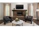 Comfortable living room featuring a stone fireplace, hardwood floors, and a cozy ambiance at 1003 North Ne Ave, Atlanta, GA 30306