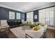 Sophisticated living room with dark blue walls, shutters, and elegant furniture at 1003 North Ne Ave, Atlanta, GA 30306