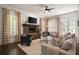 Cozy living room with a stone fireplace, hardwood floors, and natural light at 1003 North Ne Ave, Atlanta, GA 30306