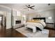 Relaxing main bedroom with hardwood floors, a ceiling fan, fireplace, and ensuite bathroom at 1003 North Ne Ave, Atlanta, GA 30306