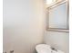Cozy bathroom with a stylish mirror, white basin sink, and modern fixtures at 11576 Kades Trl, Hampton, GA 30228