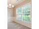Bright dining room featuring wainscoting details and large windows at 11576 Kades Trl, Hampton, GA 30228