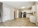 Modern kitchen with stainless steel appliances, white cabinets, and plenty of counter space at 11576 Kades Trl, Hampton, GA 30228