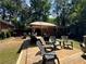 Spacious wooden deck with assorted chairs offers a great space for entertaining and enjoying the serene backyard at 224 Sourwood Dr, Marietta, GA 30062