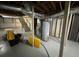 View of the unfinished basement with exposed pipes and utility systems, offering potential for customization at 224 Sourwood Dr, Marietta, GA 30062