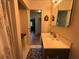 Bathroom featuring a sink, mirror and patterned floor at 224 Sourwood Dr, Marietta, GA 30062