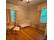 Bright Bedroom with a white crib, rocking chair, and natural light at 224 Sourwood Dr, Marietta, GA 30062