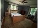 Bright bedroom with natural wood bed frame and two windows at 224 Sourwood Dr, Marietta, GA 30062