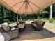 Outdoor deck with covered seating area and wicker furniture, perfect for entertaining or enjoying peaceful relaxation at 224 Sourwood Dr, Marietta, GA 30062