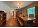 Traditional dining room featuring hardwood floors, built-in hutch, and natural light at 224 Sourwood Dr, Marietta, GA 30062