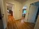Hallway with hardwood floors leads to living room and kitchen at 224 Sourwood Dr, Marietta, GA 30062