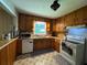 Functional kitchen featuring wood cabinets, modern appliances, and ample counter space, perfect for cooking at 224 Sourwood Dr, Marietta, GA 30062