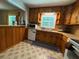 Cozy kitchen with wood cabinets, vintage details, and a functional layout, offering a warm, inviting space at 224 Sourwood Dr, Marietta, GA 30062