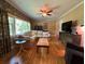 Bright living room with hardwood floors, a comfortable sectional sofa, and natural light from a large window at 224 Sourwood Dr, Marietta, GA 30062
