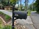 View of the home's mailbox and landscaped yard; great curb appeal in this suburban setting at 224 Sourwood Dr, Marietta, GA 30062