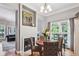 Inviting dining room featuring hardwood floors, fireplace and access to the living room at 3150 Stonewyck Pl, Decatur, GA 30033