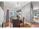 Cozy dining room featuring hardwood floors and window view to the yard at 3150 Stonewyck Pl, Decatur, GA 30033