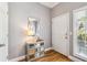 Welcoming entryway with hardwood floors, a decorative mirror and storage console at 3150 Stonewyck Pl, Decatur, GA 30033