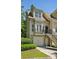 Charming townhome features a one-car garage and a staircase leading to the front door at 3150 Stonewyck Pl, Decatur, GA 30033
