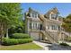 Charming townhome exterior with manicured landscaping, stairs, and one-car garage at 3150 Stonewyck Pl, Decatur, GA 30033