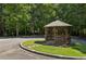 Exterior view of a gazebo set in a green, landscaped community area at 3150 Stonewyck Pl, Decatur, GA 30033