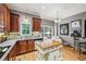 Traditional kitchen with stainless steel appliances, central island and hardwood floors at 3150 Stonewyck Pl, Decatur, GA 30033