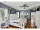 Bright main bedroom featuring a large bed, hardwood floors and neutral colors at 3150 Stonewyck Pl, Decatur, GA 30033