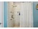 Shower stall featuring patterned tile, shower head, and shower caddy at 3150 Stonewyck Pl, Decatur, GA 30033