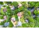 Aerial view of the house with a pond and lush, mature trees at 4710 Misty Lake Ne Ct, Kennesaw, GA 30144