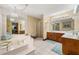 Luxurious bathroom featuring a jetted tub, shower, and dual vanity sinks at 4710 Misty Lake Ne Ct, Kennesaw, GA 30144
