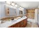 Bathroom with double sinks, granite counters, and a tiled shower-tub combination at 4710 Misty Lake Ne Ct, Kennesaw, GA 30144