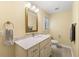 Bathroom featuring a marble vanity, tile flooring, and a framed mirror at 4710 Misty Lake Ne Ct, Kennesaw, GA 30144